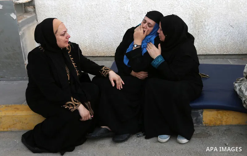 Relatives of Palestinian medic Abdullah Al-Kotati, who was killed by Israeli troops while trying to help wounded protesters during clashes where Palestinians demand the right to return to their homeland at the Israel-Gaz...