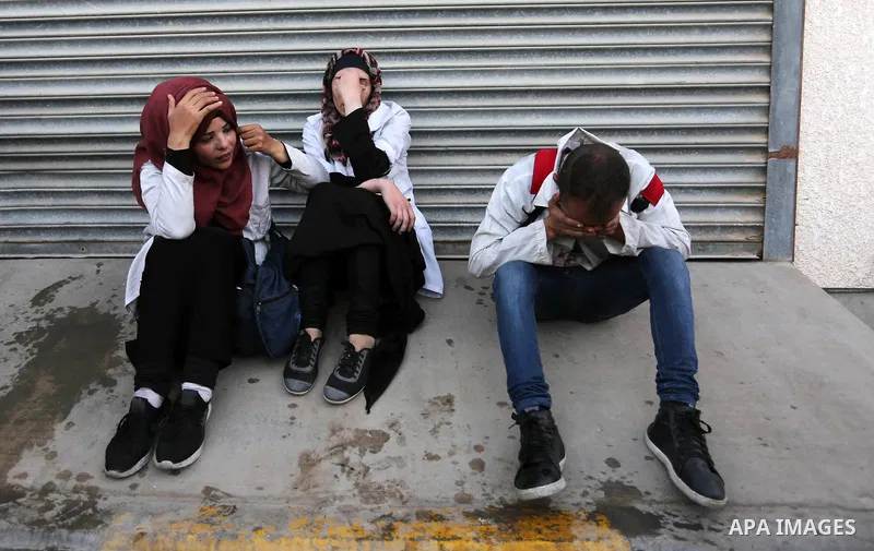 Colleagues of Palestinian medic Abdullah Al-Kotati, who was killed by Israeli troops while trying to help wounded protesters during clashes where Palestinians demand the right to return to their homeland at the Israel-Ga...