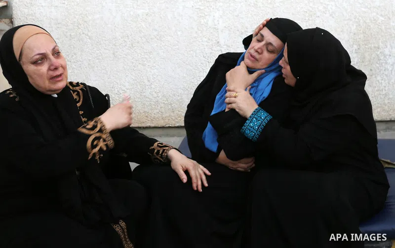 Relatives of Palestinian medic Abdullah Al-Kotati, who was killed by Israeli troops while trying to help wounded protesters during clashes where Palestinians demand the right to return to their homeland at the Israel-Gaz...