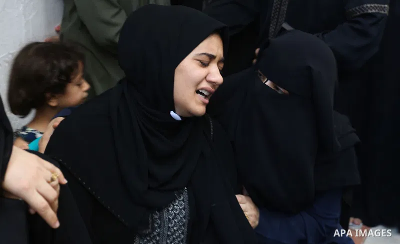 Relatives of Palestinian volunteer medic Abdullah Al-Kotati, who was killed the day before by Israeli troops while trying to help wounded protesters during clashes where Palestinians demand the right to return to their h...