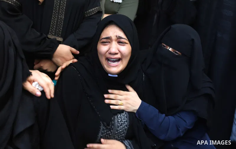 Relatives of Palestinian volunteer medic Abdullah Al-Kotati, who was killed the day before by Israeli troops while trying to help wounded protesters during clashes where Palestinians demand the right to return to their h...