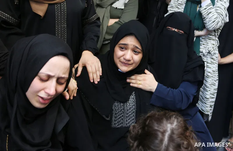 Relatives of Palestinian volunteer medic Abdullah Al-Kotati, who was killed the day before by Israeli troops while trying to help wounded protesters during clashes where Palestinians demand the right to return to their h...