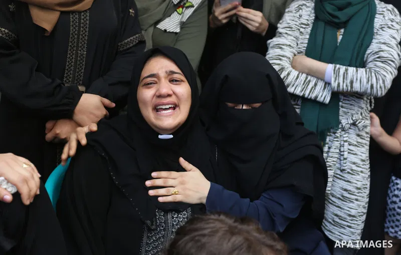 Relatives of Palestinian volunteer medic Abdullah Al-Kotati, who was killed the day before by Israeli troops while trying to help wounded protesters during clashes where Palestinians demand the right to return to their h...