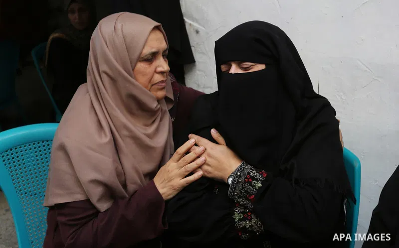 Relatives of Palestinian volunteer medic Abdullah Al-Kotati, who was killed the day before by Israeli troops while trying to help wounded protesters during clashes where Palestinians demand the right to return to their h...