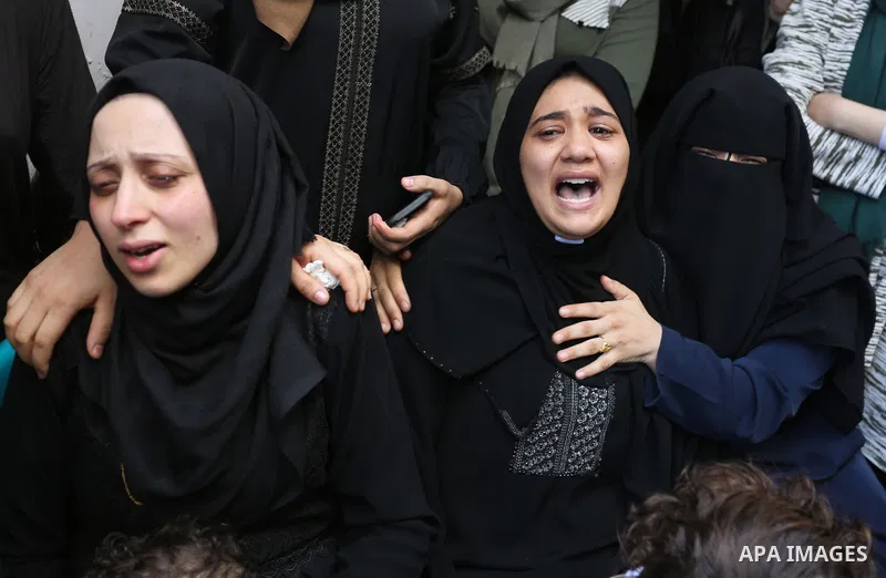 Relatives of Palestinian volunteer medic Abdullah Al-Kotati, who was killed the day before by Israeli troops while trying to help wounded protesters during clashes where Palestinians demand the right to return to their h...