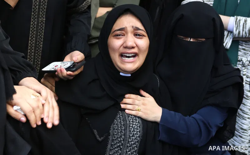 Relatives of Palestinian volunteer medic Abdullah Al-Kotati, who was killed the day before by Israeli troops while trying to help wounded protesters during clashes where Palestinians demand the right to return to their h...