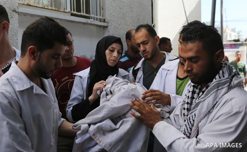 Colleagues of Palestinian volunteer medic Abdullah Al-Kotati, who was killed the day before by Israeli troops while trying to help wounded protesters during clashes where Palestinians demand the right to return to their...