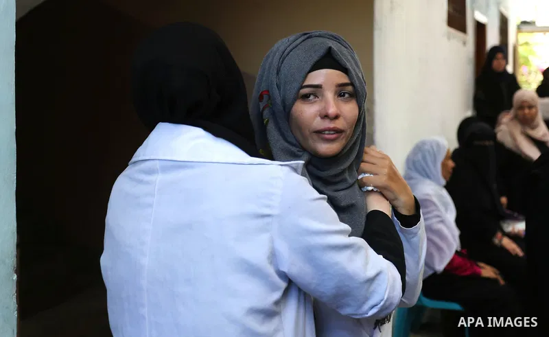 Colleagues of Palestinian volunteer medic Abdullah Al-Kotati, who was killed the day before by Israeli troops while trying to help wounded protesters during clashes where Palestinians demand the right to return to their...
