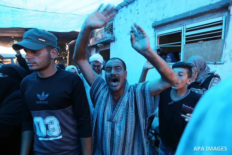 Relatives of Palestinian Ahmed Abu Louly who was killed by Israeli troops during clashes where Palestinians demand the right to return to their homeland at the Israel-Gaza border, mourn during his funeral in Rafah in the...