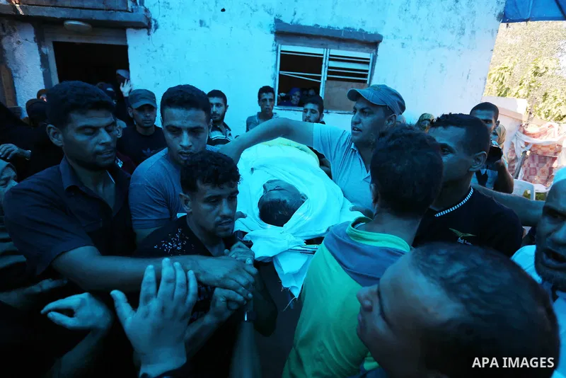 Relatives of Palestinian Ahmed Abu Louly who was killed by Israeli troops during clashes where Palestinians demand the right to return to their homeland at the Israel-Gaza border, mourn during his funeral in Rafah in the...