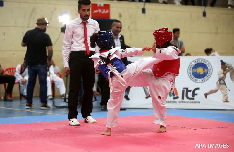 Palestinian children compete during taekwondo championship, in the West Bank city of Ramallah on August 11, 2018. Photo by Shadi Hatem