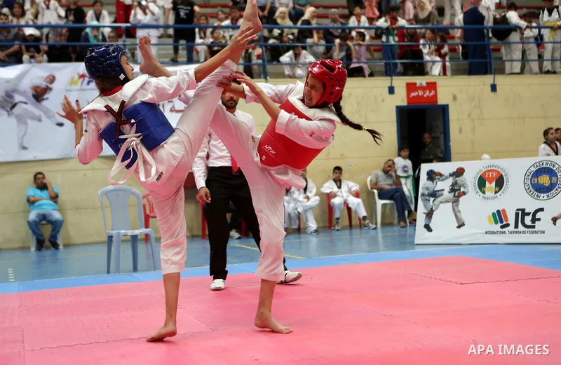 Palestinian children compete during taekwondo championship, in the West Bank city of Ramallah on August 11, 2018. Photo by Shadi Hatem