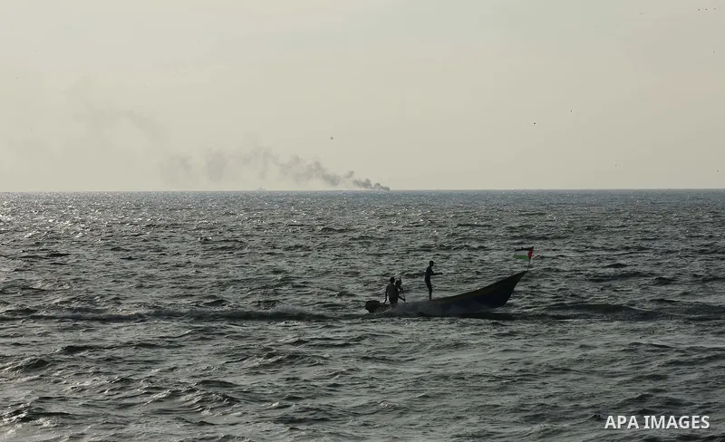 Palestinians ride fishing boats during a rally to break Israel's blockade on Gaza Strip, at the sea in Gaza City, on August 11, 2018. Photo by Dawoud Abo Alkas