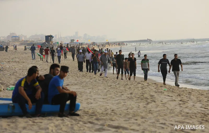 Palestinians ride fishing boats during a rally to break Israel's blockade on Gaza Strip, at the sea in Gaza City, on August 11, 2018. Photo by Dawoud Abo Alkas