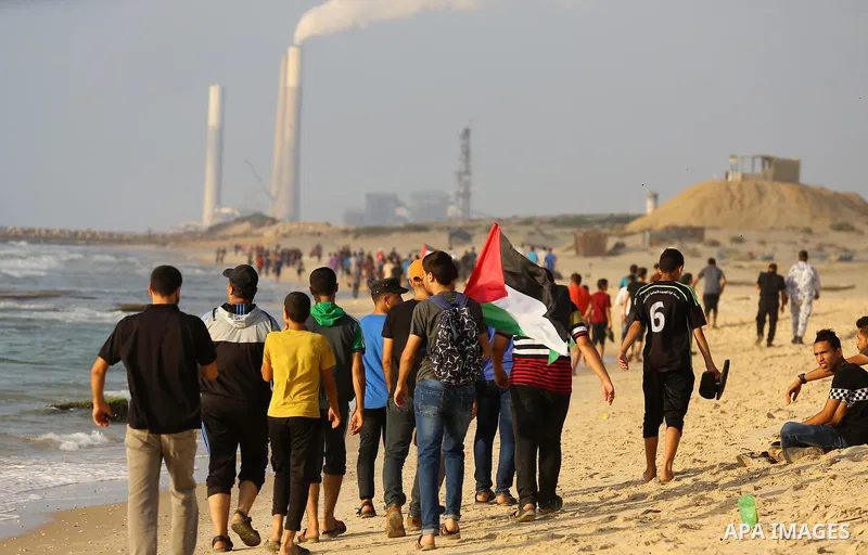 Palestinians ride fishing boats during a rally to break Israel's blockade on Gaza Strip, at the sea in Gaza City, on August 11, 2018. Photo by Dawoud Abo Alkas