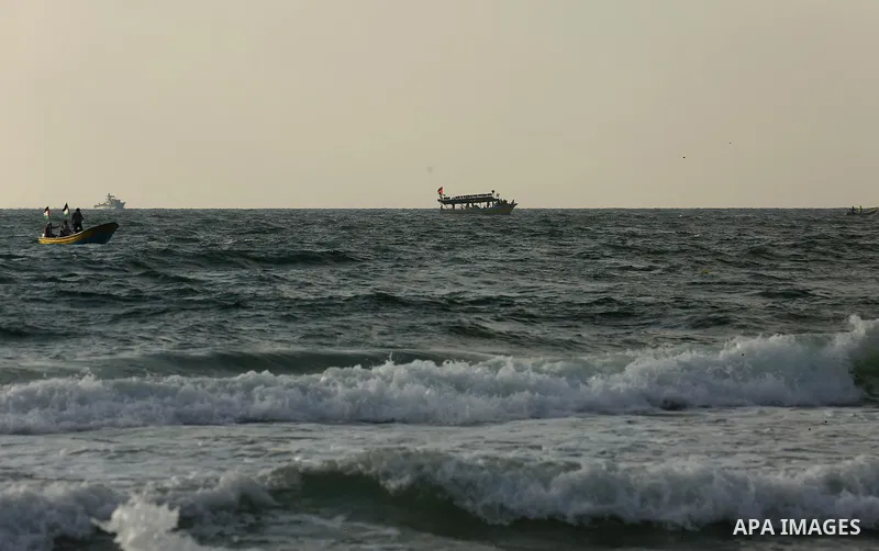 Palestinians ride fishing boats during a rally to break Israel's blockade on Gaza Strip, at the sea in Gaza City, on August 11, 2018. Photo by Dawoud Abo Alkas