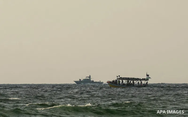 Palestinians ride fishing boats during a rally to break Israel's blockade on Gaza Strip, at the sea in Gaza City, on August 11, 2018. Photo by Dawoud Abo Alkas