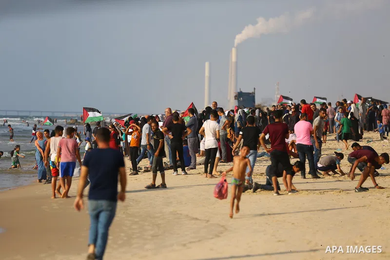 Palestinians ride fishing boats during a rally to break Israel's blockade on Gaza Strip, at the sea in Gaza City, on August 11, 2018. Photo by Dawoud Abo Alkas