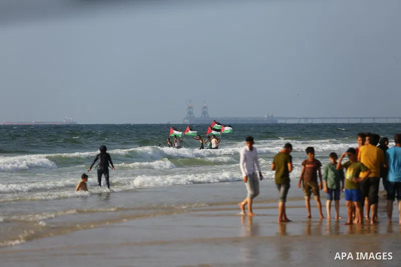 Palestinians ride fishing boats during a rally to break Israel's blockade on Gaza Strip, at the sea in Gaza City, on August 11, 2018. Photo by Dawoud Abo Alkas