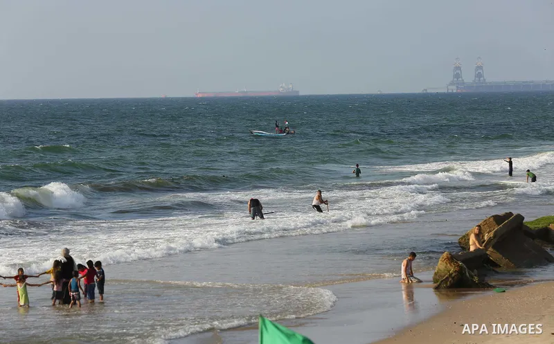 Palestinians ride fishing boats during a rally to break Israel's blockade on Gaza Strip, at the sea in Gaza City, on August 11, 2018. Photo by Dawoud Abo Alkas