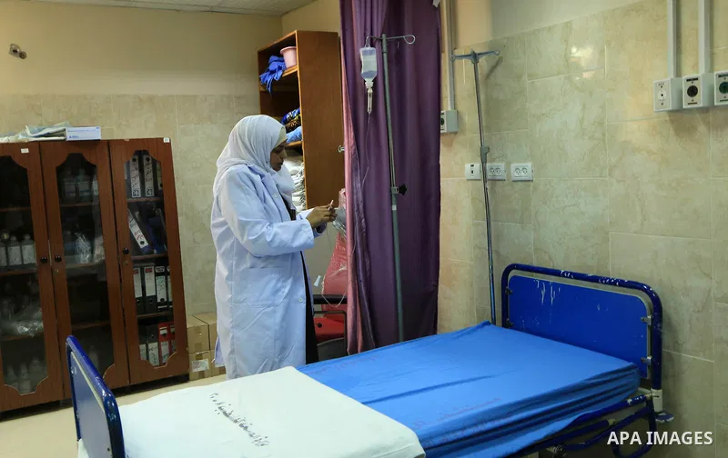 A Palestinian nurse checks the beds at al-Rantisi hospital in Gaza City on August 12, 2018. Photo by Mahmoud Khattab