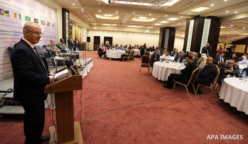 Palestinian Prime Minister, Rami Hamdallah, attends the opening of the "African training program" at the National School of Administration, in the West Bank city of Ramallah, on August 12, 2018. Photo by Prime Minister O...