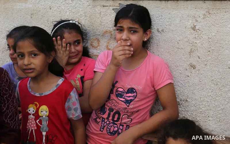 Relatives of Palestinian Wissam Hijazi, who died of wounds he sustained during clashes with Israeli troops, mourn during his funeral, in Khan Younis in the southern of Gaza Strip on August 13, 2018. Photo by Ashraf Amra