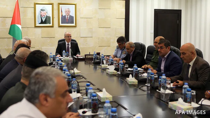 Palestinian Prime Minister, Rami Hamdallah, chairs a meeting of the leaders of the security establishment, in the West Bank city of Ramallah, on August 13, 2018. Photo by Prime Minister Office