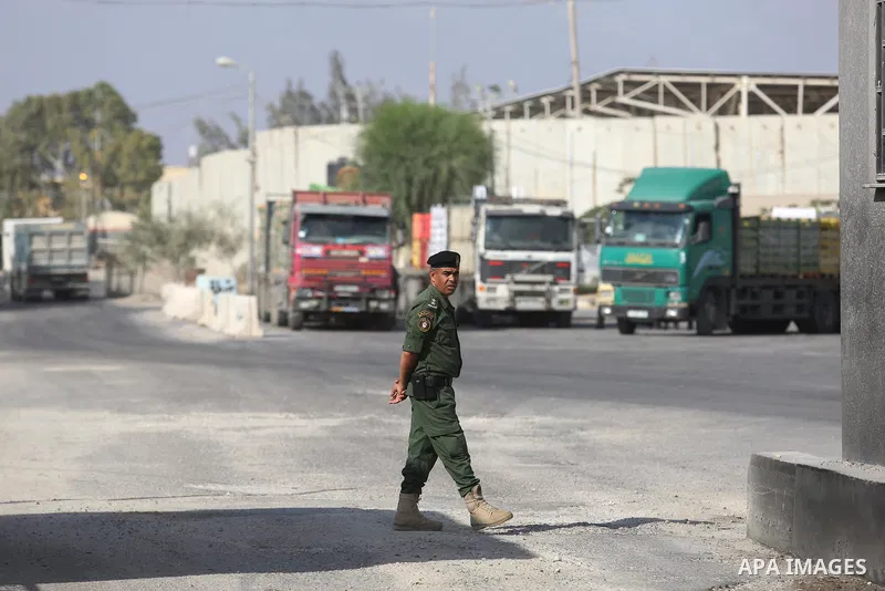 A Palestinian security force stands guard as a fuel tanker arrives at Kerem Shalom crossing in Rafah in the southern Gaza Strip, on August 15, 2018. Israel's defence minister has announced it will reopen the main cargo c...