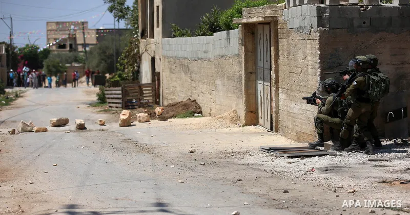 Israeli forces take position during clashes with Palestinian protesters following a weekly demonstration against the expropriation of Palestinian land by Israel in the village of Kfar Qaddum, near the West Bank city of N...
