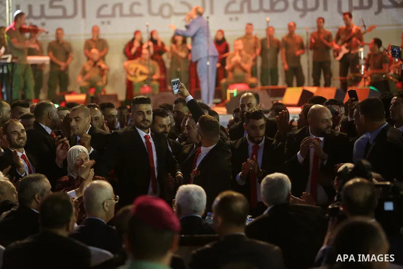 Palestinian couples take part in a mass wedding celebration held under the patronage of Palestinian President Mahmoud Abbas, in the West Bank city of Ramallah on August 18, 2018. Photo by Shadi Hatem