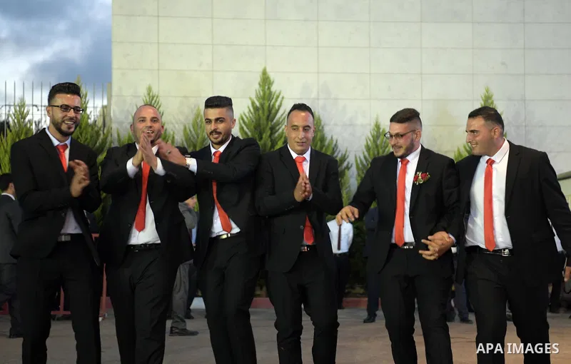 Palestinian couples take part in a mass wedding celebration held under the patronage of Palestinian President Mahmoud Abbas, in the West Bank city of Ramallah on August 18, 2018. Photo by Thaer Ganaim