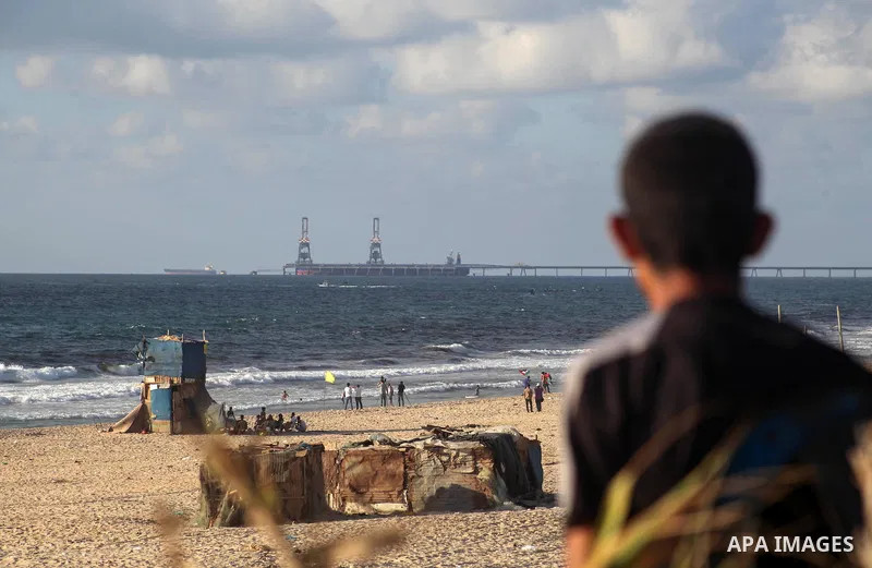 Palestinians ride fishing boats during a rally to break Israel's blockade on Gaza Strip, at the sea in Gaza City, August 18, 2018. Photo by Ramez Habboub