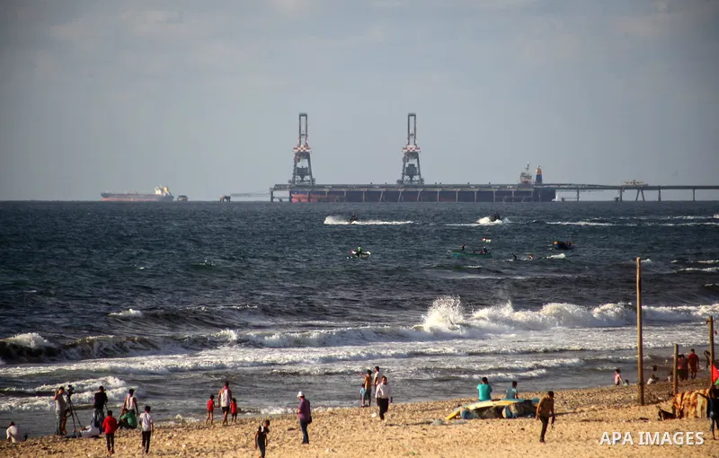 Palestinians ride fishing boats during a rally to break Israel's blockade on Gaza Strip, at the sea in Gaza City, August 18, 2018. Photo by Ramez Habboub