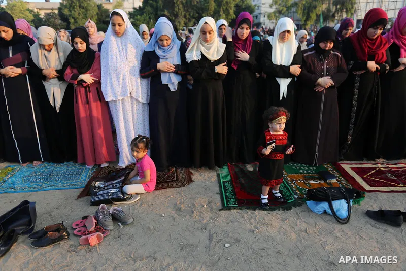 Palestinian muslims perform the prayer of Eid al-Adha or the feast of sacrifice in Gaza city, on August 21, 2018. Muslims around the world are celebrating Eid al-Adha, the "Feast of Sacrifice", which marks the end of the...