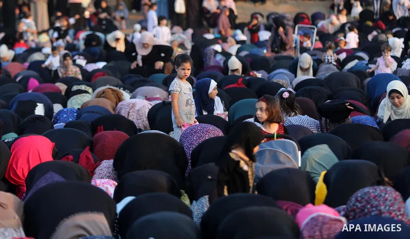 Palestinian muslims perform the prayer of Eid al-Adha or the feast of sacrifice in Gaza city, on August 21, 2018. Muslims around the world are celebrating Eid al-Adha, the "Feast of Sacrifice", which marks the end of the...