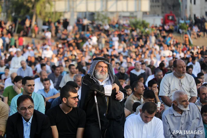 Palestinian muslims perform the prayer of Eid al-Adha or the feast of sacrifice in Gaza city, on August 21, 2018. Muslims around the world are celebrating Eid al-Adha, the "Feast of Sacrifice", which marks the end of the...