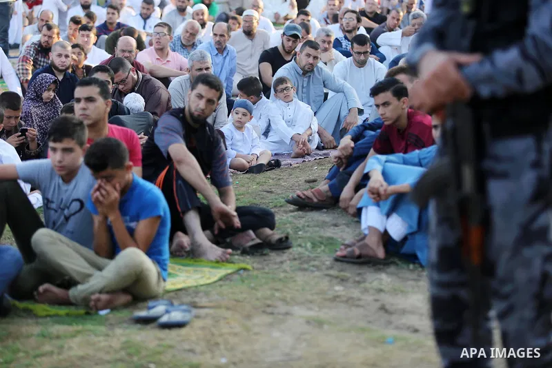 Palestinian muslims perform the prayer of Eid al-Adha or the feast of sacrifice in Gaza city, on August 21, 2018. Muslims around the world are celebrating Eid al-Adha, the "Feast of Sacrifice", which marks the end of the...