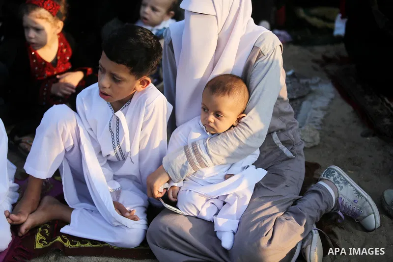 Palestinian muslims perform the prayer of Eid al-Adha or the feast of sacrifice in Gaza city, on August 21, 2018. Muslims around the world are celebrating Eid al-Adha, the "Feast of Sacrifice", which marks the end of the...