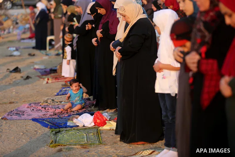 Palestinian muslims perform the prayer of Eid al-Adha or the feast of sacrifice in Gaza city, on August 21, 2018. Muslims around the world are celebrating Eid al-Adha, the "Feast of Sacrifice", which marks the end of the...
