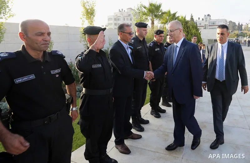 Palestinian Prime Minister Rami Hamdallah performs the prayer of Eid al-Adha or the feast of sacrifice in the West Bank city of Ramallah on August 21, 2018. Muslims around the world are celebrating Eid al-Adha, the "Feas...
