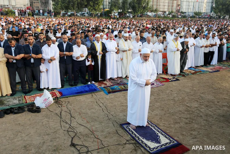 Chairman of the political bureau of the Hamas Palestinian Islamist movement, Ismail Haniyeh performs the prayer of Eid al-Adha or the feast of sacrifice in Gaza city, on August 21, 2018. Muslims around the world are cele...