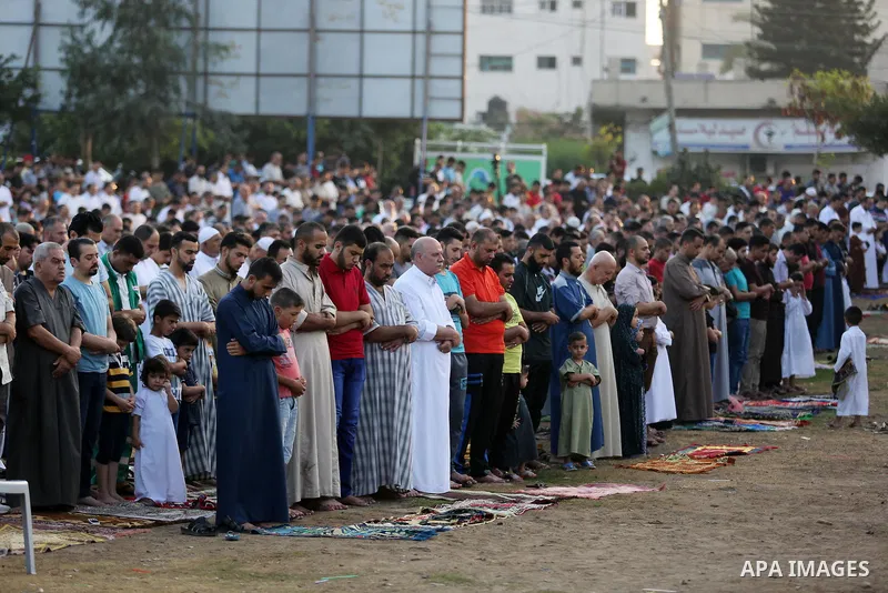 Palestinian muslims perform the prayer of Eid al-Adha or the feast of sacrifice in Gaza city, on August 21, 2018. Muslims around the world are celebrating Eid al-Adha, the "Feast of Sacrifice", which marks the end of the...
