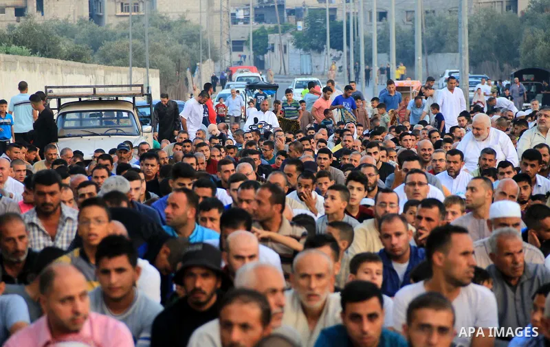 Palestinian muslims perform the prayer of Eid al-Adha or the feast of sacrifice, in al-Bureij refugee camp in the center of Gaza Strip, on August 21, 2018. Muslims around the world are celebrating Eid al-Adha, the "Feast...