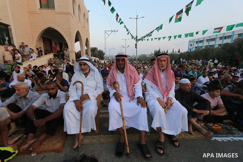 Palestinian muslims perform the prayer of Eid al-Adha or the feast of sacrifice, in al-Bureij refugee camp in the center of Gaza Strip, on August 21, 2018. Muslims around the world are celebrating Eid al-Adha, the "Feast...