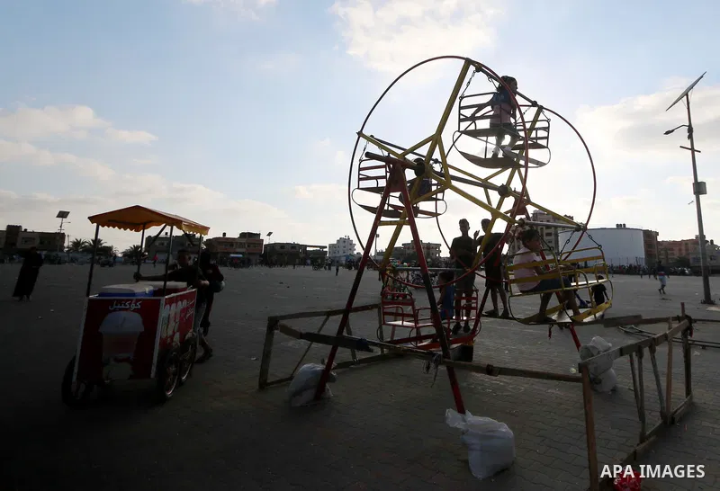 Palestinian children enjoy their time on the third day of Eid al-Adha or feast of the sacrifice, in al-Nusairat in the center of Gaza Strip on August 23, 2018. Muslims around the world are celebrating Eid al-Adha, the "F...