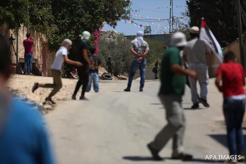 Israeli forces take position during clashes with Palestinian protesters following a weekly demonstration against the expropriation of Palestinian land by Israel in the village of Kfar Qaddum, near the West Bank city of N...