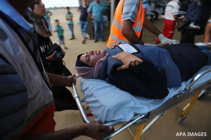 Palestinian protesters gather during clashes with Israeli troops in tents protest where Palestinians demand the right to return to their homeland at the Israel-Gaza border, in Khan Younis in the southern of Gaza Strip on...