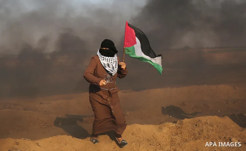 Palestinian protesters gather during clashes with Israeli troops in tents protest where Palestinians demand the right to return to their homeland at the Israel-Gaza border, in Khan Younis in the southern of Gaza Strip on...