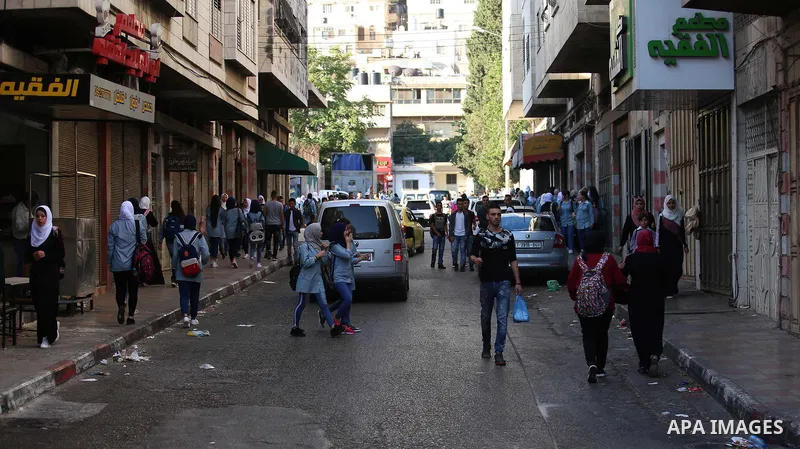 Palestinian students return back to their school in the morning of the first day of the new year study, in the West Bank city of Nablus on August 29, 2018. Photo by Shadi Jarar'ah